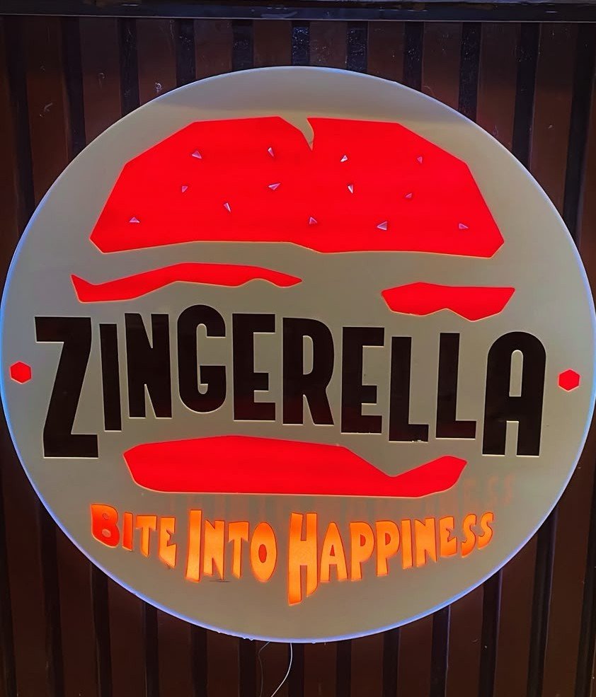 Zingerella zinger burger with fries and a cold drink